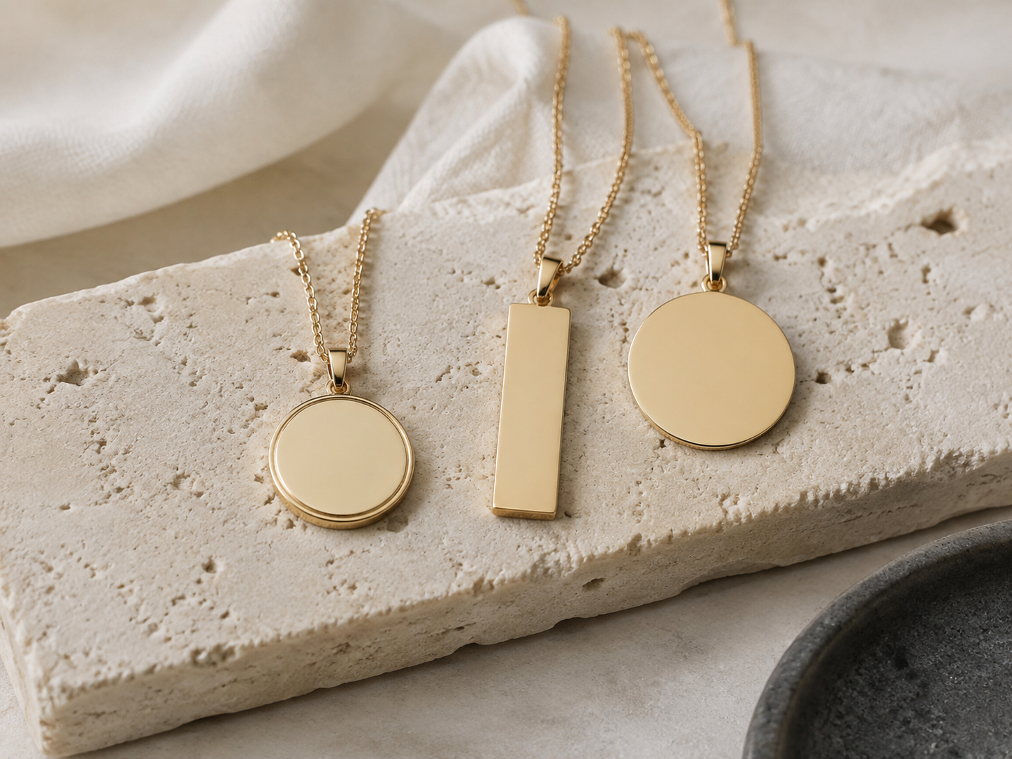 Three blank necklace pendants for choosing a name date or initials