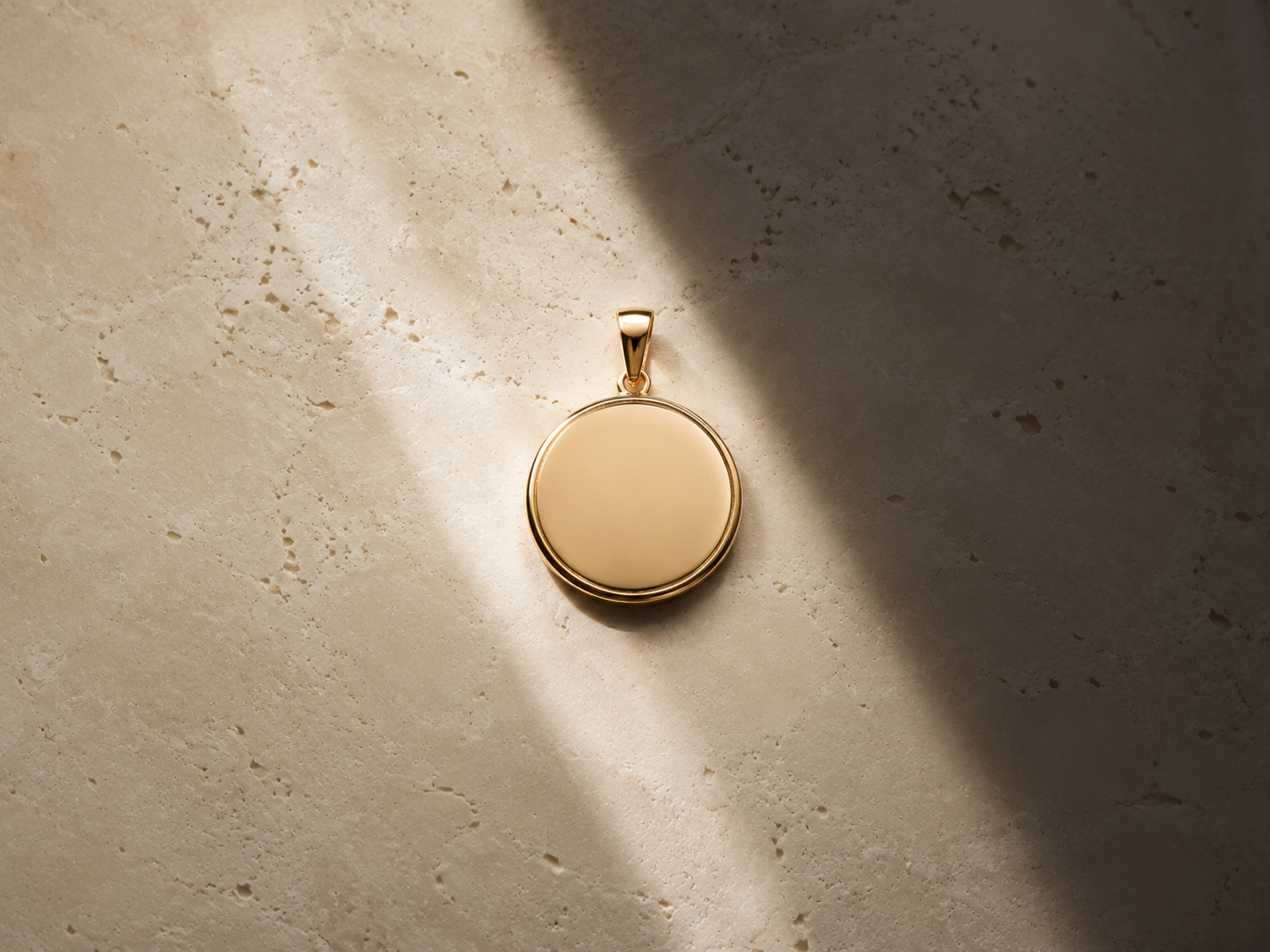 Single blank round pendant highlighted by natural light
