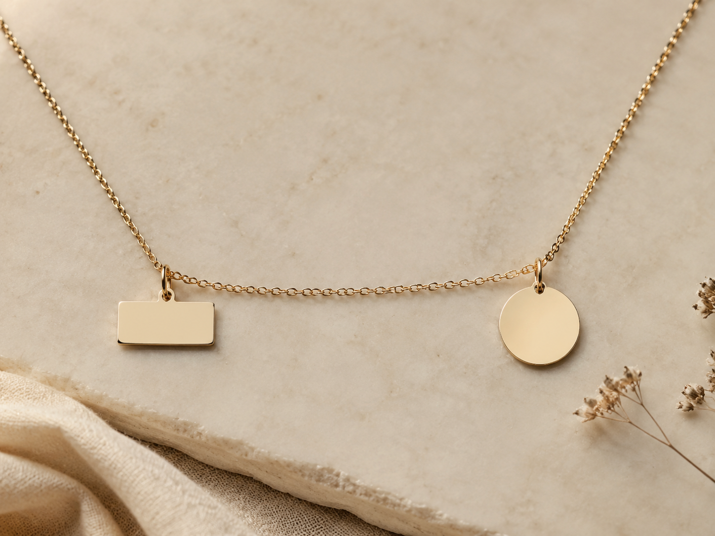 Blank nameplate and round pendant representing a name or date engraving