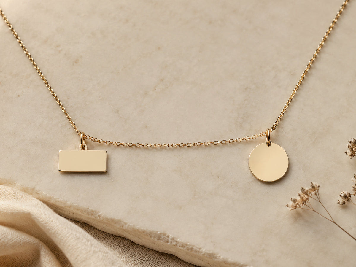 Blank nameplate and round pendant representing a name or date engraving