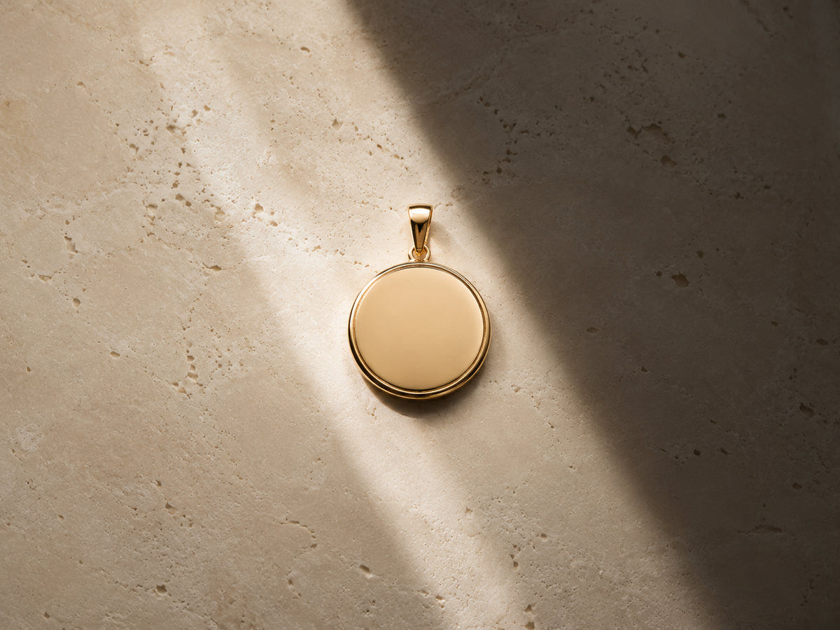 Single blank round pendant highlighted by natural light